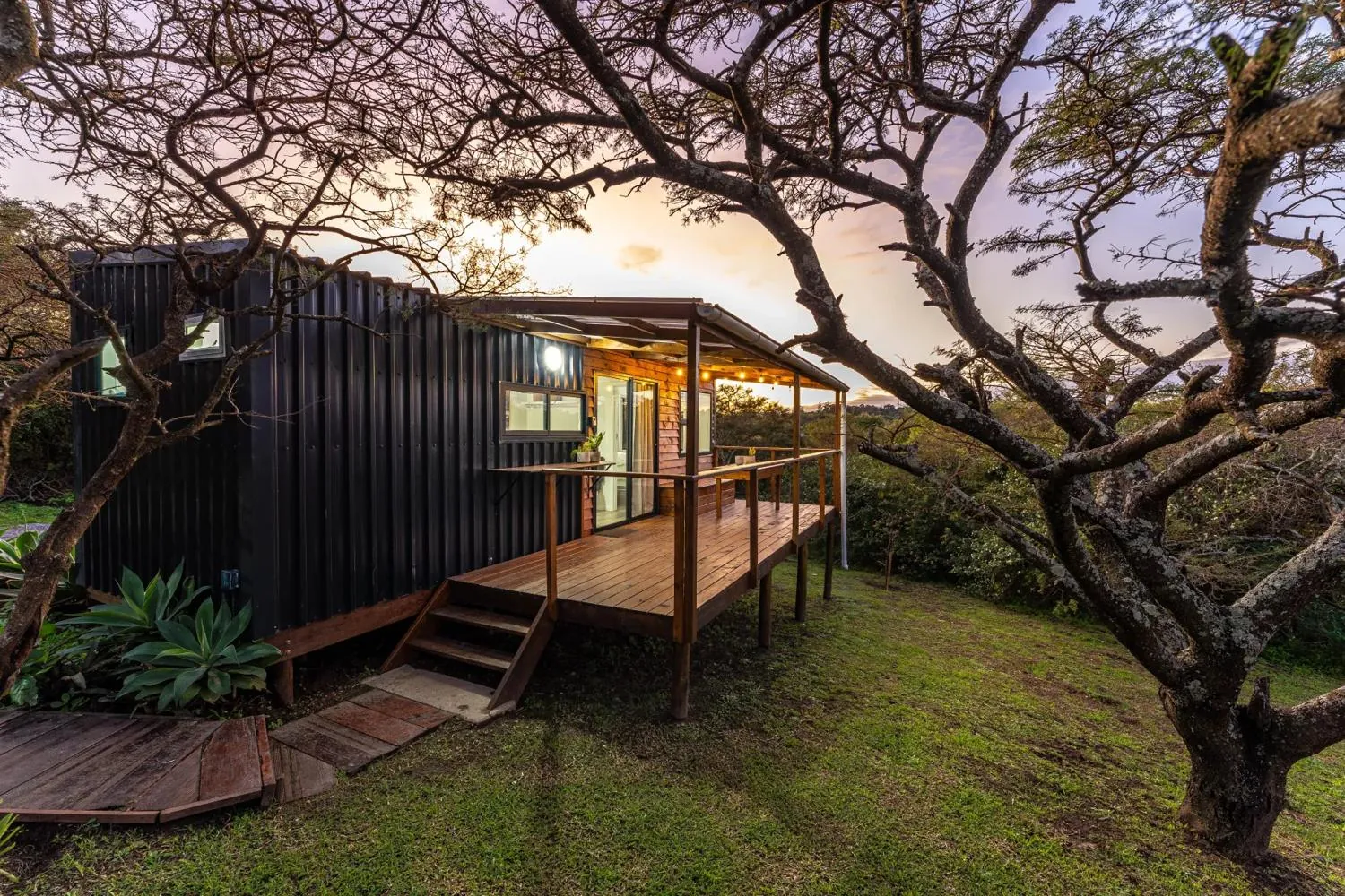 A tiny home deck at dusk